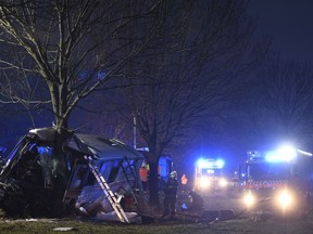 Rescue workers and firemen work at a bus after its collision with a car at Horomerice near Prague, Czech Republic, Friday 12, 2018. The accident claimed three lives and 30 injuries. At least ten people have serious injuries.