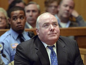 FILE - In this Nov. 21, 2013 file photo, Michael Skakel reacts to being granted bail during his bond hearing at Stamford Superior Court in Stamford, Conn. Connecticut officials are asking the state's highest court to revoke Skakel's bail and send him back to prison. The chief state's attorney's office filed the request Monday, Jan. 29, 2018 with the state Supreme Court. Skakel, a nephew of Robert F. Kennedy's widow, Ethel Kennedy, was convicted in 2002 of murdering Martha Moxley in their wealthy Greenwich neighborhood in 1975, when they were both teenagers.