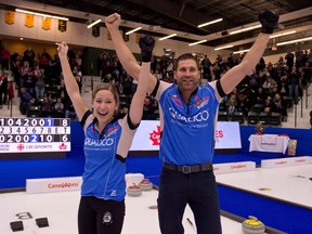 Kaitlyn Lawes and John Morris celebrate their 8-6 victory over Val Sweeting and Brad Gushue in the mixed doubles Olympic trials final in Portage la Prairie, Man., on Jan. 7.