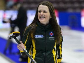 Northern Ontario skip Tracy Fleury smiles while taking on Manitoba's Jennifer Jones at the Scotties Tournament of Hearts in Penticton, B.C., on Wednesday.