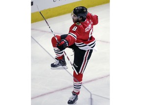 Chicago Blackhawks center Nick Schmaltz celebrates after scoring a goal against the Edmonton Oilers during the first period of an NHL hockey game Sunday, Jan. 7, 2018, in Chicago.