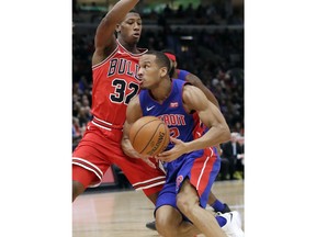 Detroit Pistons guard Avery Bradley, right, drives to the basket against Chicago Bulls guard Kris Dunn during the first half of an NBA basketball game Saturday, Jan. 13, 2018, in Chicago.