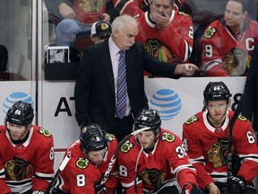 Chicago Blackhawks head coach Joel Quenneville points as he talks to his team during the first period of an NHL hockey game against the Edmonton Oilers, Sunday, Jan. 7, 2018, in Chicago.