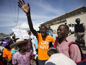 Demonstrators chant outside the U.S. embassy during a protest against President Donald Trump's recent disparaging comments about Haiti and African nations, in Tabarre, a district of Port-au-Prince, Haiti, Thursday, Jan. 18, 2018. Community leaders and activists say thousands of Haitian immigrants living in the U.S. under a temporary protected status will face employment and travel hurdles because Trump's administration delayed the process of re-registering them.