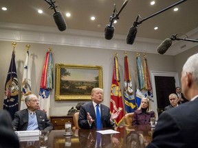 President Donald Trump, accompanied by Sen. Chuck Grassley, R-Iowa, left, Secretary of Homeland Security Kirstjen Nielsen, second from right, and Sen. Thom Tillis, R-N.C., right, speaks at a meeting on immigration with Republican Senators in the Roosevelt Room at the White House, Thursday, Jan. 4, 2018, in Washington.