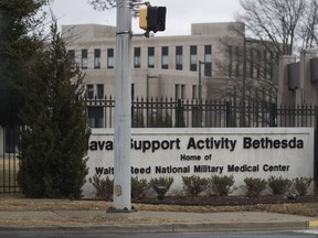 The entrance to Walter Reed National Military Medical Center in Bethesda, Md., is seen from the media van in President Donald Trump's motorcade as it arrives Friday, Jan. 12, 2018, where he will have his first medical check-up as president.