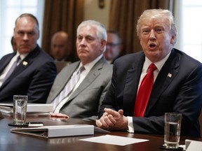 President Donald Trump speaks during a cabinet meeting at the White House, Wednesday, Jan. 10, 2018, in Washington. From left, Secretary of Interior Ryan Zinke, Secretary of State Rex Tillerson, and Trump.