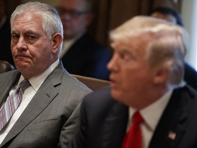 Secretary of State Rex Tillerson, left, listens to President Donald Trump speak during a cabinet meeting at the White House, Wednesday, Jan. 10, 2018, in Washington.