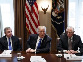Sen. Dick Durbin, D-Ill., left, and Rep. Steny Hoyer, D-Md. listen as President Donald Trump speaks during a meeting with lawmakers on immigration policy in the Cabinet Room of the White House, Tuesday, Jan. 9, 2018, in Washington.