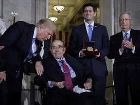 President Donald Trump speaks to former Sen Bob Dole during a Congressional Gold Medal ceremony honoring Dole on Capitol Hill, Wednesday, Jan. 17, 2018, in Washington, as House Speaker Paul Ryan of Wis., and Senate Majority Leader Mitch McConnell, watch.