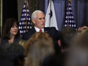 Vice President Mike Pence with his wife Karen Pence, left, speaks to anti-abortion supporters and participants of the annual March for Life event, during a reception in the Indian Treaty Room at the Eisenhower Executive Office Building on the White House complex in Washington, Thursday, Jan. 18, 2018.