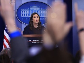 White House press secretary Sarah Huckabee Sanders talks to reporters during the daily press briefing in the Brady press briefing room at the White House, in Washington, Tuesday, Jan. 9, 2018.