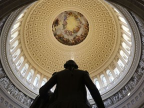 The Capitol Rotunda is seen with the statue of George Washington on Capitol Hill in Washington, Tuesday, Jan. 30, 2018, ahead of the State of the Union address by President Donald Trump.