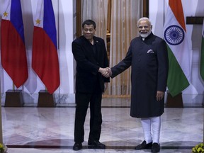 Philippine President Rodrigo Duterte, left and Indian Prime Minister Narendra Modi pose for the media ahead of their meeting in New Delhi, India, Wednesday, Jan.24, 2018. The leaders of the Association of Southeast Asian Nations, or ASEAN, are gathering in New Delhi to celebrate 25 years of the group's ties with India. (AP Photo)
