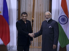 Philippine President Rodrigo Duterte, left and Indian Prime Minister Narendra Modi pose for the media ahead of their meeting in New Delhi, India, Wednesday, Jan.24, 2018. The leaders of the Association of Southeast Asian Nations, or ASEAN, are gathering in New Delhi to celebrate 25 years of the group's ties with India. (AP Photo)