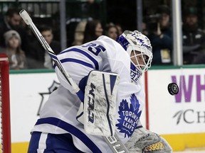 Toronto Maple Leafs goaltender Curtis McElhinney (35) stops a shot from the Dallas Stars in the first period of an NHL hockey game Thursday, Jan. 25, 2018, in Dallas.