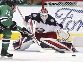 Columbus Blue Jackets goaltender Sergei Bobrovsky (72) defends the goal against Dallas Stars center Mattias Janmark (13) during the first period of an NHL hockey game in Dallas, Tuesday, Jan. 2, 2018.
