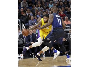 Los Angeles Lakers' Brandon Ingram, left, attempts to drive around Orlando Magic's Jonathon Simmons (17) during the first half of an NBA basketball game, Wednesday, Jan. 31, 2018, in Orlando, Fla.