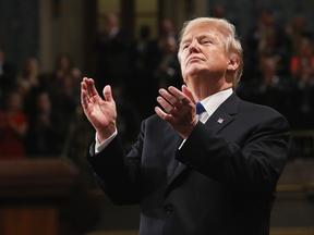 U.S. President Donald J. Trump claps during his State of the Union address on Jan. 30, 2018.