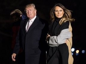 President Donald Trump and First Lady Melania Trump return to the White House following a weekend trip to Mar-a-Lago, Fla., on Jan. 15, 2018.