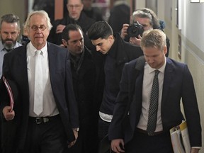 Dortmund's Marc Bartra of Spain arrives with lawyers at the courtroom in Dortmund, Germany, to testify as witness at the trial against a man, charged with the attempted murder of Borussia Dortmund's soccer team by detonating homemade bombs on their bus, Monday, Jan. 29, 2018. Bartra was injured from the detonation.