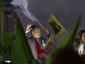 Ecuador's former President Rafael Correa leads a rally against an upcoming constitutional referendum in Rumicucho, Ecuador, Monday, Jan. 29, 2018. Sunday's referendum, called by current President Lenin Moreno, will present voters with seven questions, from making it impossible for Correa to run again for president, to lengthening the statute of limitations in cases of sexual abuse, to expanding national park territory to reduce oil drilling.