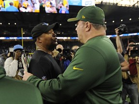 Detroit Lions head coach Jim Caldwell, left, meets with Green Bay Packers head coach Mike McCarthy after an NFL football game, Sunday, Dec. 31, 2017, in Detroit.