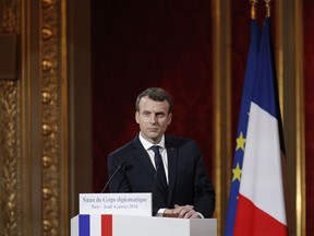 French President Emmanuel Macron delivers his New Year address to diplomats at the Elysee Palace in Paris, Thursday Jan. 4, 2018.