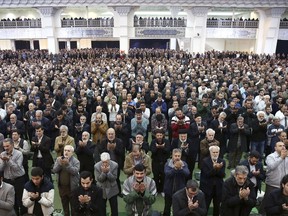 Iranian worshippers attend the Friday prayer ceremony in Tehran, Iran, Jan. 5, 2018. A hard-line Iranian cleric has called on Iran to create its own indigenous social media apps, blaming them for the unrest that followed days of protest in the Islamic Republic over its economy.