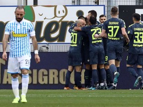 Inter Milan's players celebrate after Spal's Francesco Vicari scored an own goal during a Serie A soccer match between Spal and Inter Milan, at the Paolo Mazza Stadium in Ferrara, northern Italy, Sunday, Jan. 28, 2018.