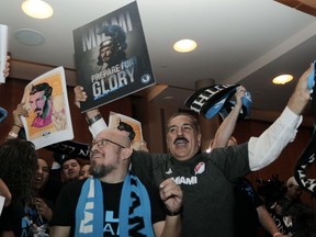 Soccer fans celebrate before an announcement by Major League Soccer that an MLS expansion team is coming to Miami, backed by David Beckham and investors, Monday, Jan. 29, 2018, in Miami.