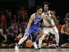 Duke's Gary Trent Jr (2) drives as Miami's Lonnie Walker IV defends during the second half of an NCAA college basketball game, Monday, Jan. 15, 2018, in Coral Gables, Fla.