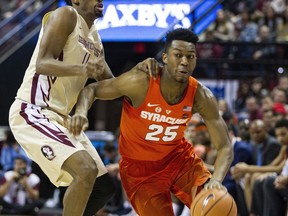 Syracuse's Tyus Battle tries to get past Florida State's Braian Angola in the first half of an NCAA college basketball game in Tallahassee, Fla., Saturday, Jan. 13, 2018.