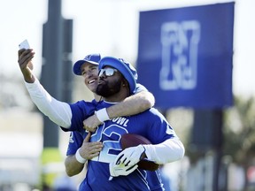 NFC quarterback Drew Brees, left,and running back Alvin Kamara, both of the New Orleans Saints, take a selfie during Pro Bowl NFL football practice, Wednesday, Jan. 24, 2018, in Kissimmee, Fla.