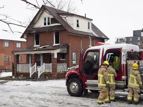 Firefighters pack up after responding to a house fire in Oshawa, Ont. on Monday, January 8, 2018. Two adults and two children have been killed in a house fire east of Toronto that also sent three other people to hospital, fire officials said Monday.THE CANADIAN PRESS/Frank Gunn
