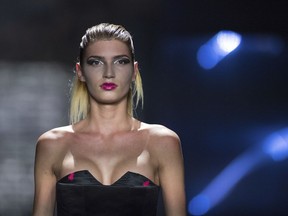 FILE - the July 7, 2017 file photo shows model Giuliana who became well known with the show "Germany's Next Topmodel" during a fashion show in Berlin. Germany's edition of Playboy magazine said it will be featuring the transgender model on its cover for the first time ever this month.