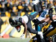 Leonard Fournette of the Jacksonville Jaguars dives into the end zone for a touchdown against the Pittsburgh Steelers during the first half of the AFC Divisional Playoff game at Heinz Field on January 14, 2018 in Pittsburgh, Penn.