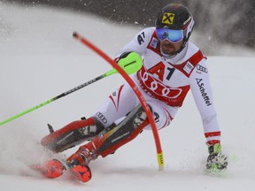Austria's Marcel Hirscher speeds down the course during an alpine ski, men's World Cup slalom, in Kitzbuehel, Austria, Sunday, Jan. 21, 2018.