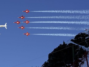 The Swiss Air Force acrobatic squad performs prior to an alpine ski, men's World Cup downhill in Wengen, Switzerland, Saturday, Jan. 13, 2018.