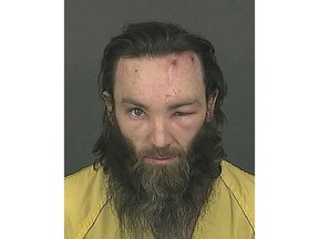 FILE - This file booking photo released on Feb. 2, 2017, by the Denver Police Department shows homicide suspect Joshua Cummings in Denver. Cummings was convicted on Thursday, Jan. 25, 2018, of first-degree murder in the killing a transit security guard in downtown Denver last year. (Denver Police Department via AP, File)