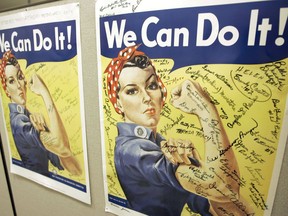 File - In this Oct. 31, 2007 file photo, a poster showing signatures of former Rosie the Riveter's is seen at the offices of the Rosie the Riveter/World War II Home Front National Historic Park in Richmond, Calif. A woman identified by a scholar as the inspiration for Rosie the Riveter, the iconic female World War II factory worker, has died in Washington state. The New York Times reports that Naomi Parker Fraley died Saturday, Jan. 20, 2018, in Longview. She was 96. Multiple women have been identified over the years as possible models for Rosie, but a Seton Hall University professor in 2016 focused on Fraley as the true inspiration.