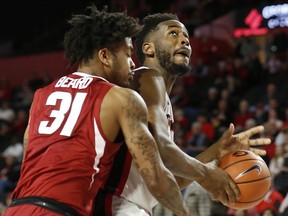 Georgia forward Yante Maten (1) tries to get by Arkansas guard Anton Beard (31) during the first half of an NCAA college basketball game in Athens, Ga., Tuesday, Jan. 23, 2018.