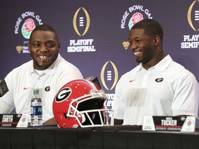 Georgia nose guard John Atkins, left, and linebacker Roquan Smith laugh during an NCAA college football news conference, Friday, Dec. 29, 2017, in Los Angeles. Oklahoma plays Georgia in the Rose Bowl on New Year's Day.