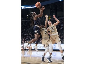 Notre Dame guard Jackie Young shoots as Georgia Tech guard Kierra Fletcher (41) and guard Francesca Pan (33) defend during the first half of an NCAA college basketball game Sunday, Jan. 7, 2018, in Atlanta.