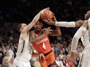 Clemson guard Shelton Mitchell (4) tries to get past Georgia Tech guard Jose Alvarado (10) in the first half of an NCAA college basketball game Sunday, Jan. 28, 2018, in Atlanta.