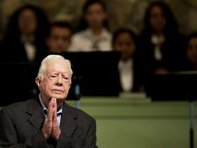 FILE - In this Aug. 23, 2015, file photo, former President Jimmy Carter teaches Sunday School class at Maranatha Baptist Church in his hometown of Plains, Ga. The Carter Center said, Friday, Jan. 19, 2018, that the 93-year-old will begin limiting his duties at the church in the coming months. The former president remains active, but was hospitalized last year when he became dehydrated during a Habitat for Humanity project.