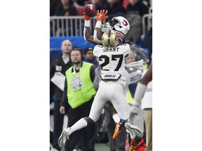 Auburn wide receiver Nate Craig-Myers (3) makes the catch against Central Florida defensive back Richie Grant (27) during the first half of the Peach Bowl NCAA college football game, Monday, Jan. 1, 2018, in Atlanta.