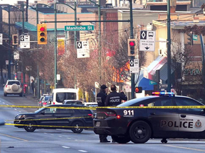 Police on the scene of an shootout that left 15-year-old Alfred Wong and known-gangster Kevin Whiteside dead. Wong was an innocent victim caught in the deadly crossfire.