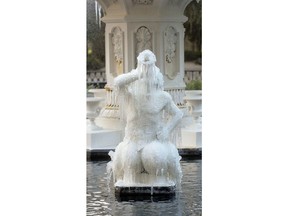 Icicles form on the tritons in the Forsyth Park Fountain Tuesday morning, Jan. 2, 2018, in Savannah, Ga.  Savannah is shivering through a rare bout with icy weather, with the National Weather Service predicting that up to 2 inches of snow and sleet could fall Wednesday on the typically balmy coastal city.