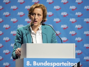FILE - In this Dec. 3, 2017 file photo Beatrix von Storch of the nationalist and anti-Islam Alternative for Germany party delivers a speech during a party congress in Hannover, Germany. Von Storch has run into trouble with police and Twitter over her response to a Cologne police tweet offering New Year greetings in Arabic. She tweeted her objections to a Saturday police tweet in Arabic, alongside other foreign languages. (Hauke-Christian Dittrich/dpa via AP, file) ORG XMIT: LGL101